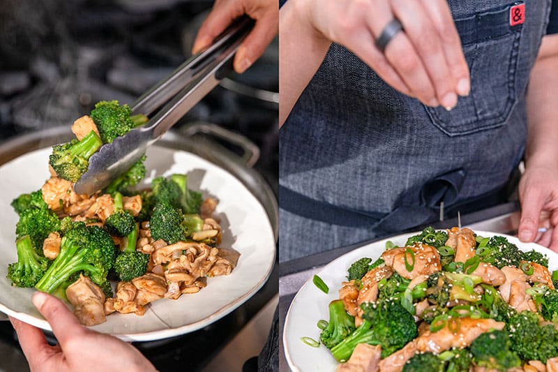 Using tongs to put the gluten-free chicken and broccoli stir-fry on a serving plate and sprinkling sesame seeds on top.