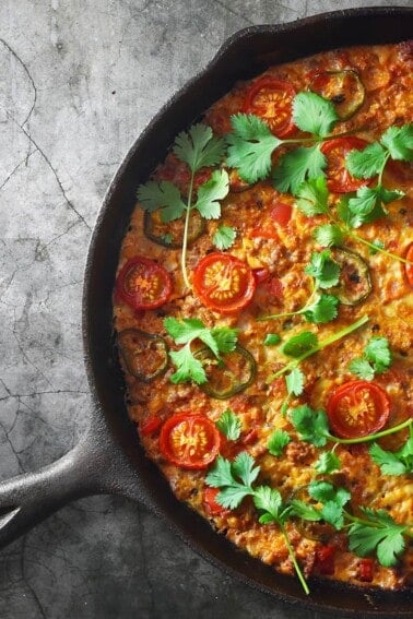 An overhead shot of Nom Nom Paleo's Tex-Mex Beef and Cauliflower Rice Casserole, a healthy Whole30 one-skillet recipe.