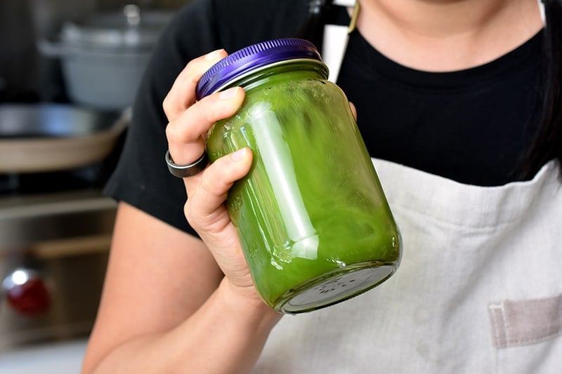 Shaking the matcha lemonade (green tea Arnold Palmer) in a mason jar.