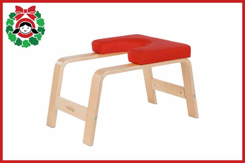 A red FeetUp inversion chair, an item on the 2020 Holiday Gift Guide from Nom Nom Paleo