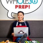 A smiling Asian woman with a laptop and Nom Nom Paleo cookbooks near her has a word bubble that says, "January Whole30 Prep!"