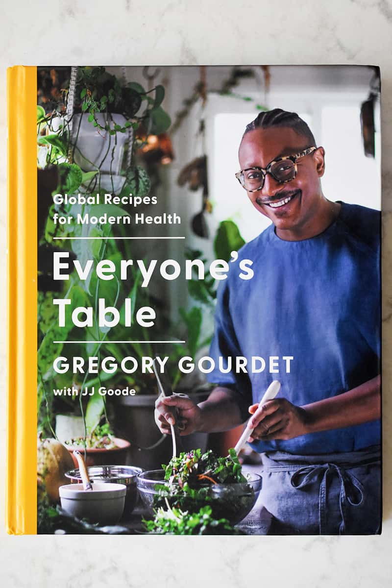 An overhead shot of Gregory Gourdet's cookbook, Everyone's Table