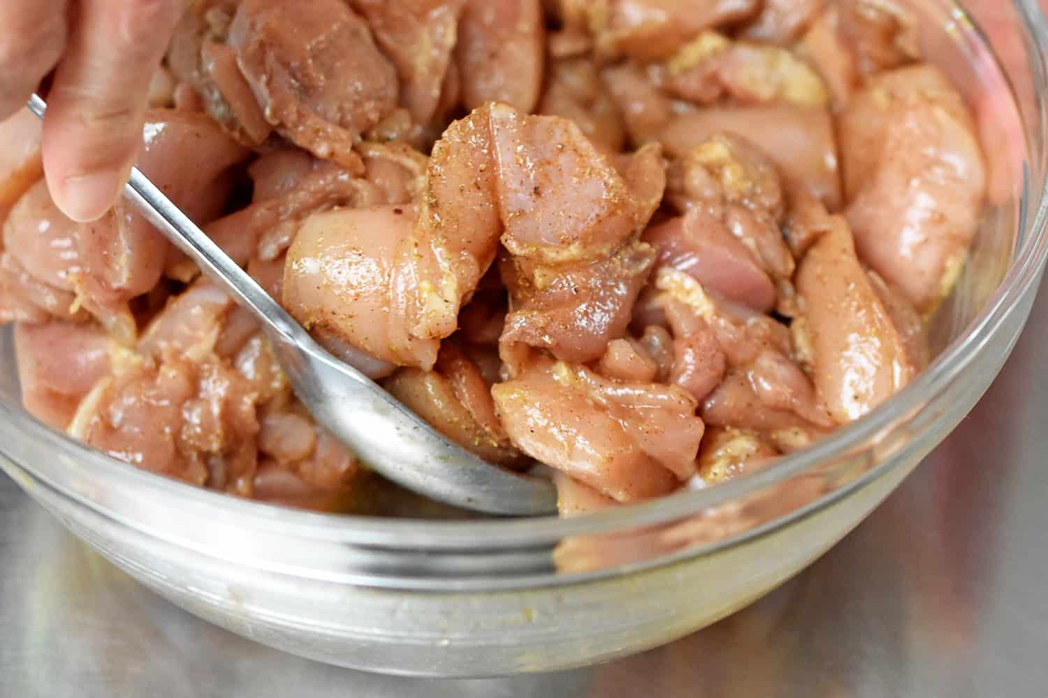 An overhead shot of marinated chicken thigh cubes for Taiwanese popcorn chicken