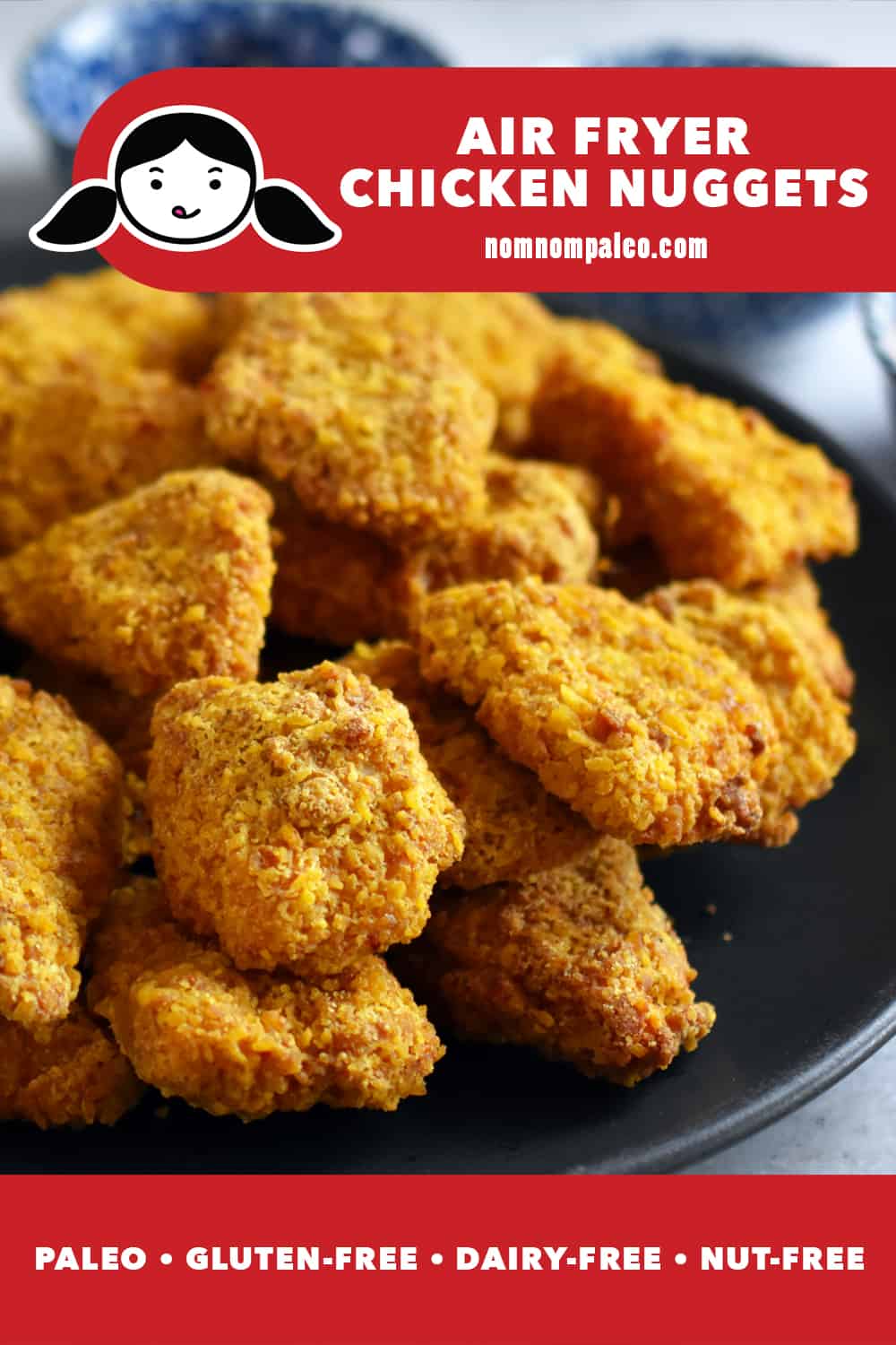 A closeup of a plate piled high with air fryer chicken nuggets. The red banner at the bottom reads: paleo, gluten-free, grain-free, and nut-free