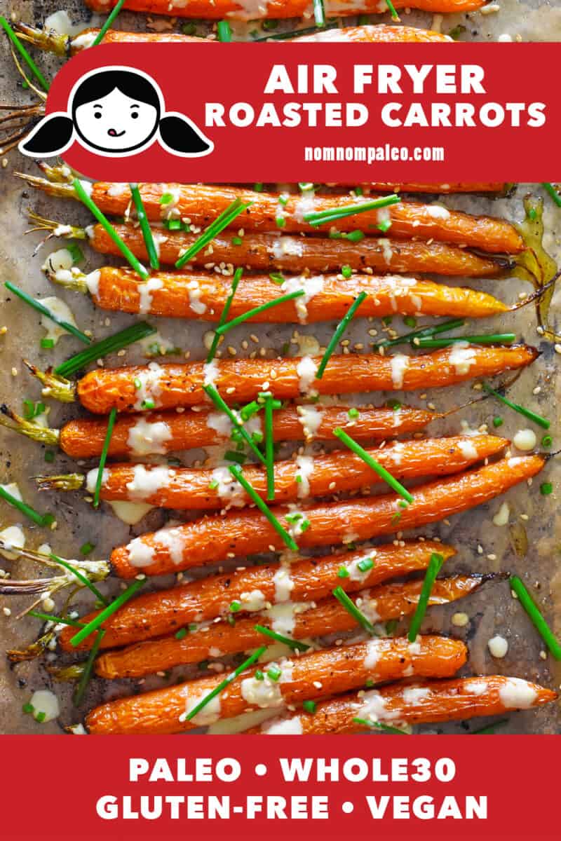 An overhead shot of air fryer carrots with sesame ginger dressing and fresh chives.