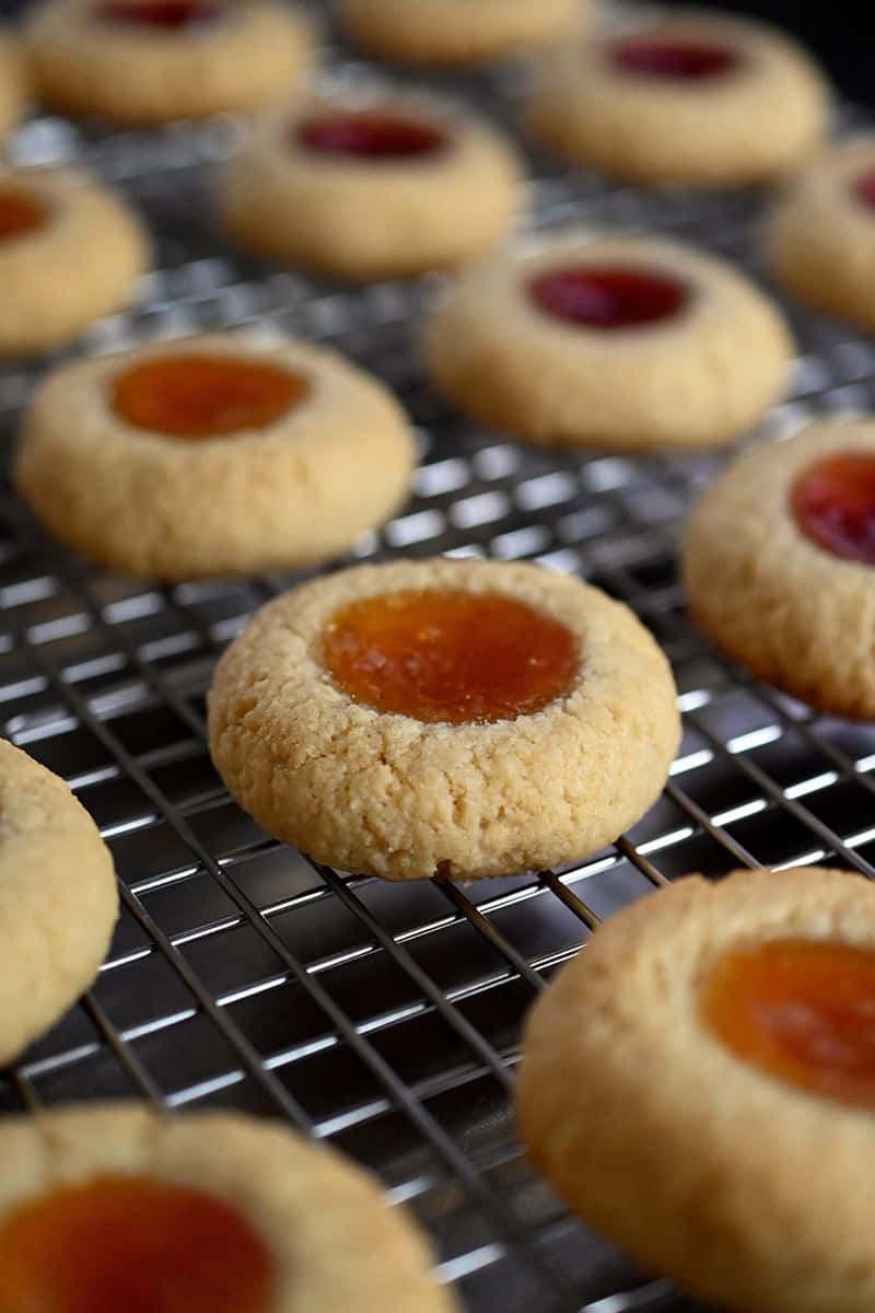 Paleo thumbprint cookies cooling on a wire rack