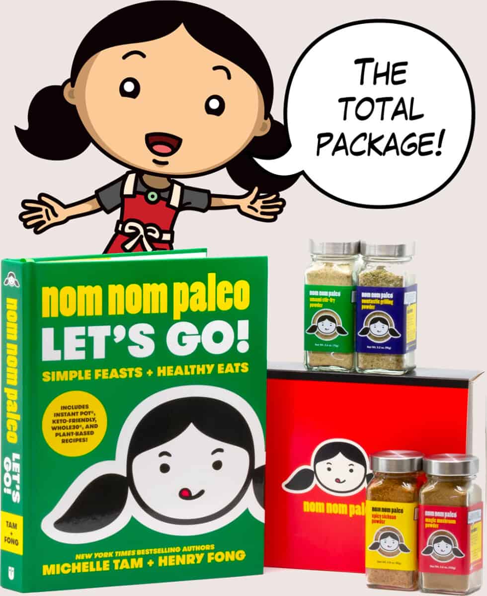 Photo of Nom Nom Paleo's new cookbook, Let's Go!, along with the collection of new spice blends, with a cartoon image of Michelle Tam saying "The total package!"