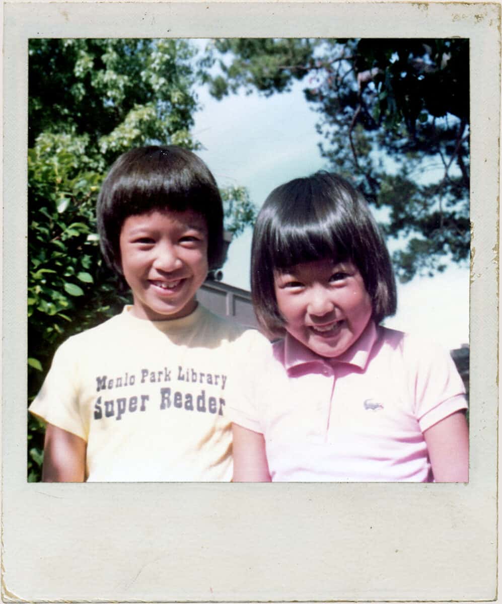 Polaroid photograph of Fiona and Michelle as children, with Fiona wearing a t-shirt reading "Menlo Park Library Super Reader"