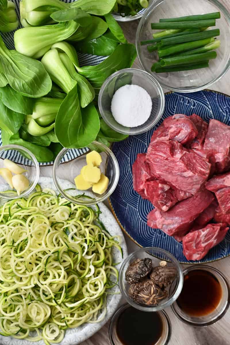 An overhead shot of the raw ingredients for Nom Nom Paleo's Chinese Beef Noodle Soup