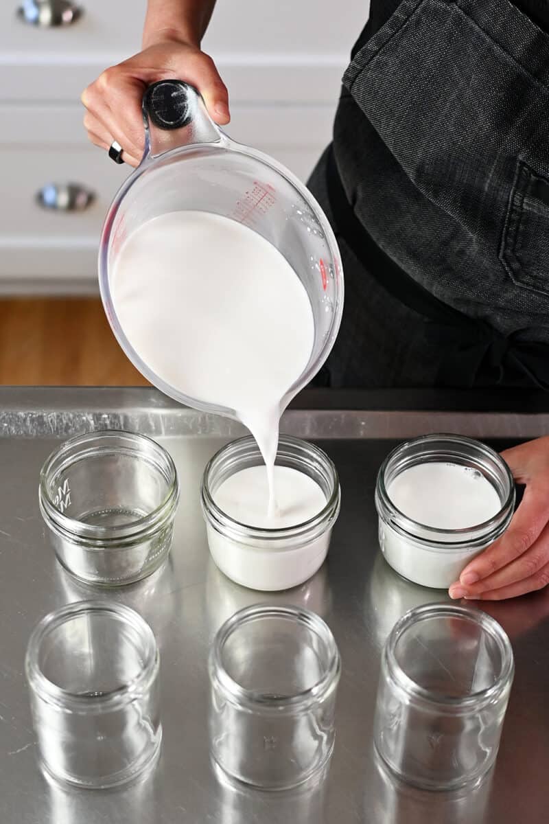 Pouring the hot coconut jelly liquid into glass jars