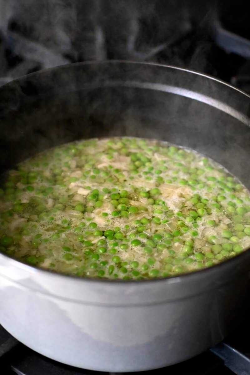 A pot of pea soup simmering on the stove.