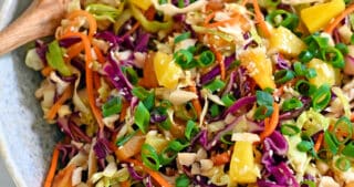 An overhead shot of a large bowl filled with pineapple coleslaw.