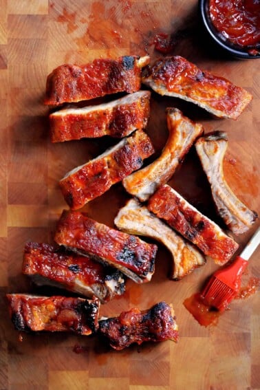 An overhead shot of oven baked baby back ribs with a Whole30, paleo, and gluten free BBQ sauce brushed in top.