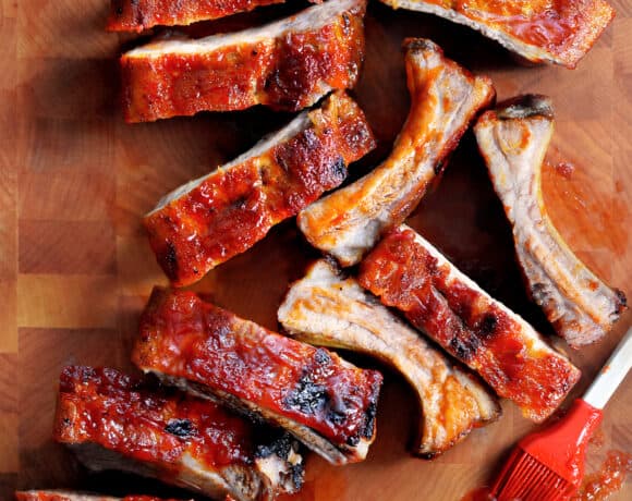 An overhead shot of oven baked baby back ribs with a Whole30, paleo, and gluten free BBQ sauce brushed in top.