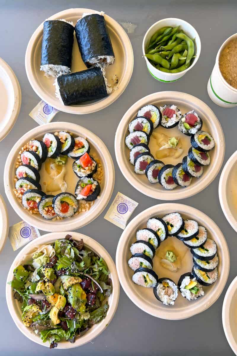 An overhead shot of takeout sushi, poke, and spam musubi from Sushi Girl Kauai.