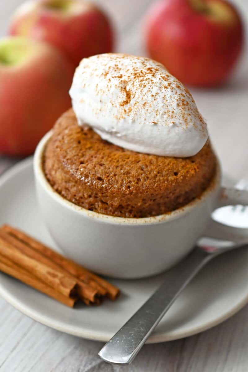 A side shot of a gluten free mug cake flavored with apple and cinnamon.