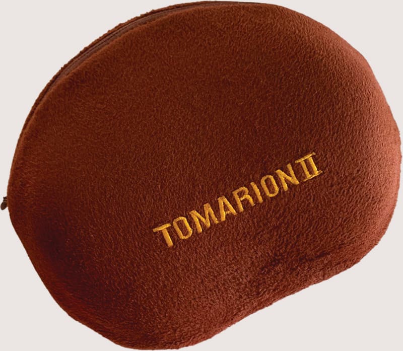 A Tomarion 2, a brown kidney shaped infrared heating pad.