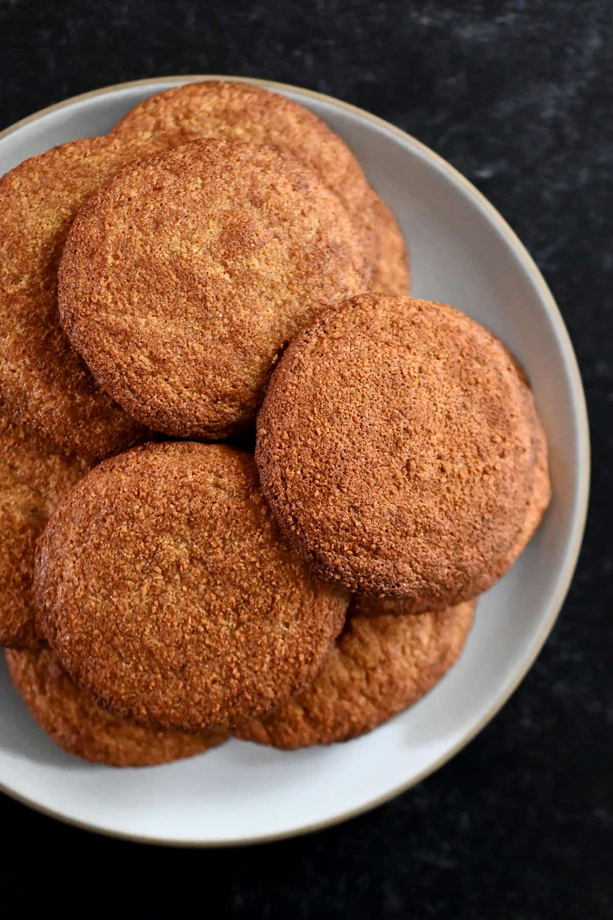 A plate topped with paleo and gluten free snickerdoodle cookies.