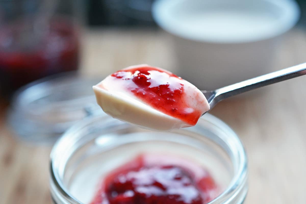 A spoonful of strawberry Panna Cotta.